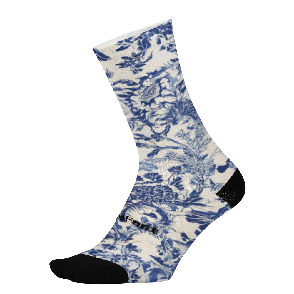 DeFeet Ikigai sock with blue floral pattern on a white background