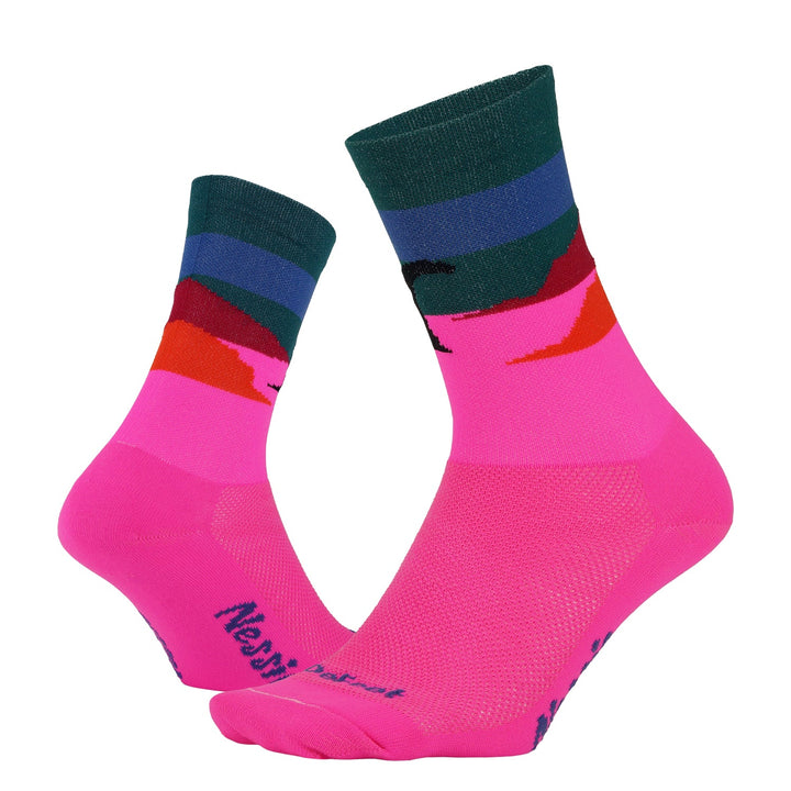 two bright pink crew socks with Nessie the loch ness monster