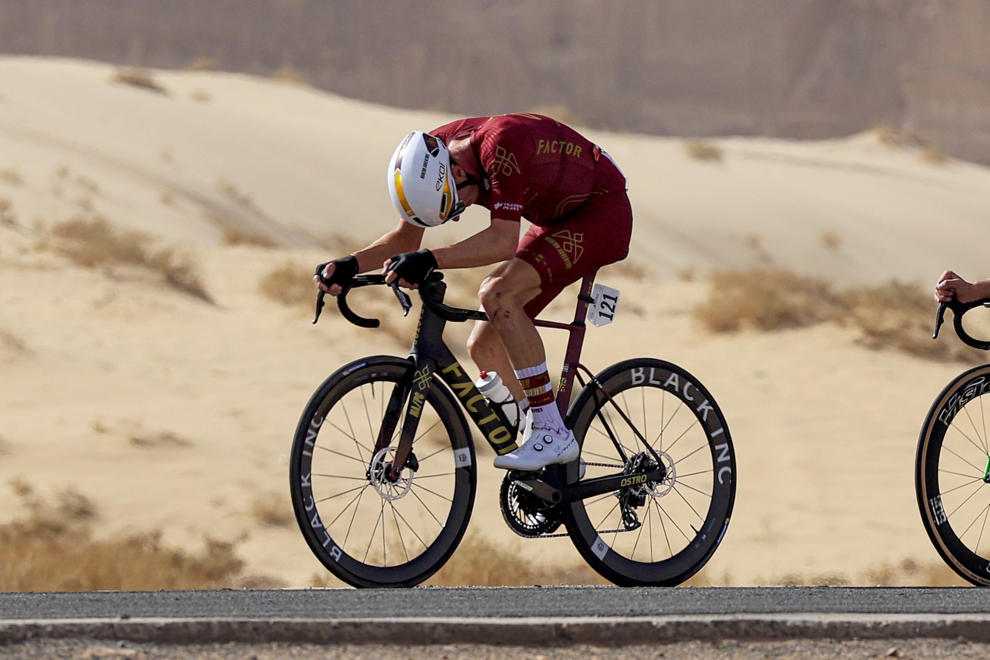 Modern Adventure Pro Cycling racing EVO Jet Aero while riding solo in the hot desert wind