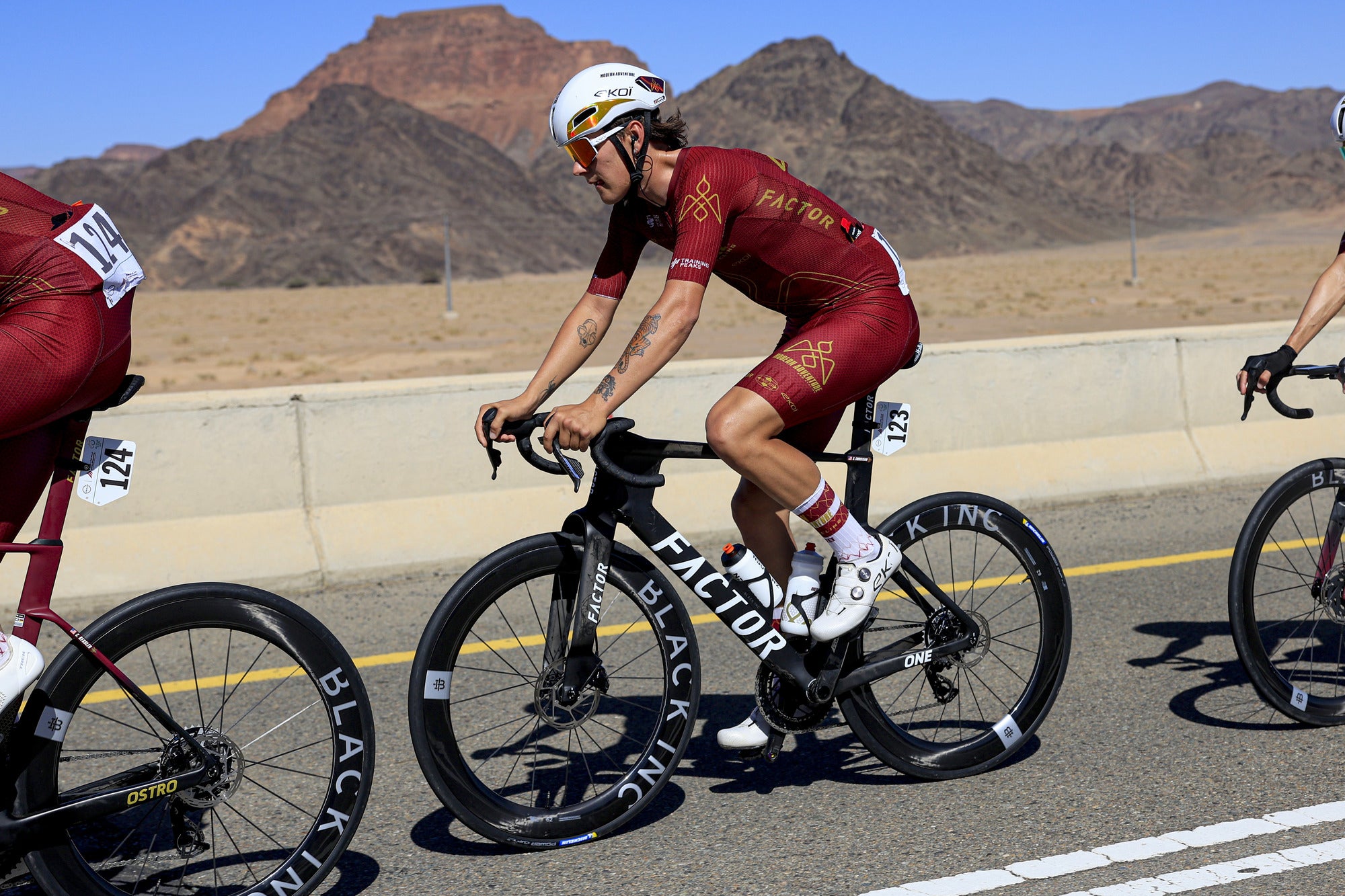 Modern Adventure Pro Cycling rider wearing DeFeet cycling socks racing in the desert