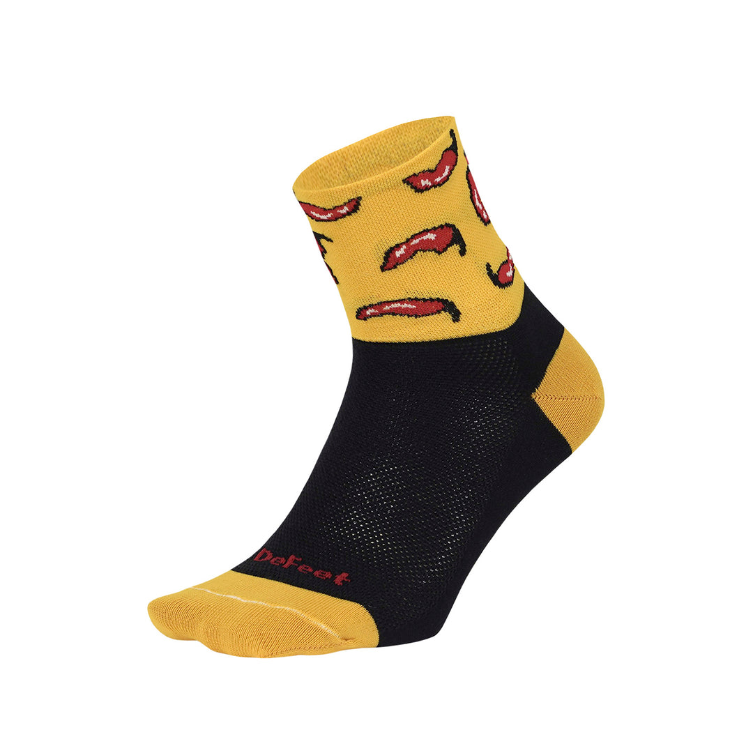 Aireator 3" cuff cycling sock in black with yellow heel & toe featuring red chili peppers on cuff